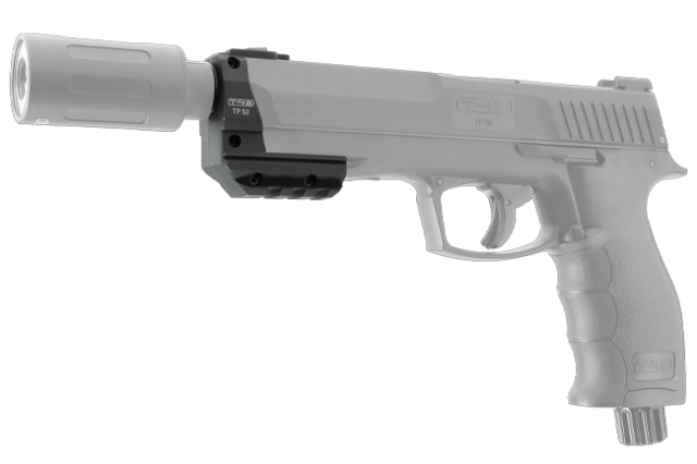 Monteres direkte på Picatinny-skinnen på din TP50 og giver samtidig en ekstra Picatinny-skinne i bunden til montering af andet tilbehør som lys eller laser. Leveres med en mønstret beskyttelsesmøtrik til gevindet. Kompatibilitet: TP50 Gen1 & Gen2 Tilbehør: Passer til X-Tracer 50 + Tracerballs (TRB) Ekstra funktion: Bundmonteret Picatinny til andet udstyr Materiale: Slidstærk polymer Inkluderet: Beskyttelsesmøtrik til gevind Gør din TP50 mere funktionel – både til træning og spil i mørke.